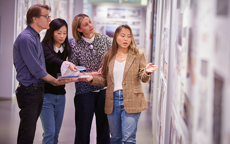 A student presents her design to 3 professors in a NYSID Design Studio